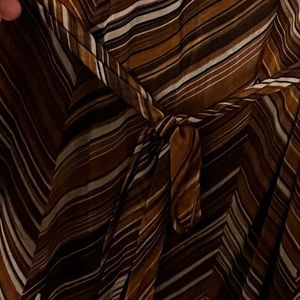 Gently used brown striped dress. V neck in front and the back.